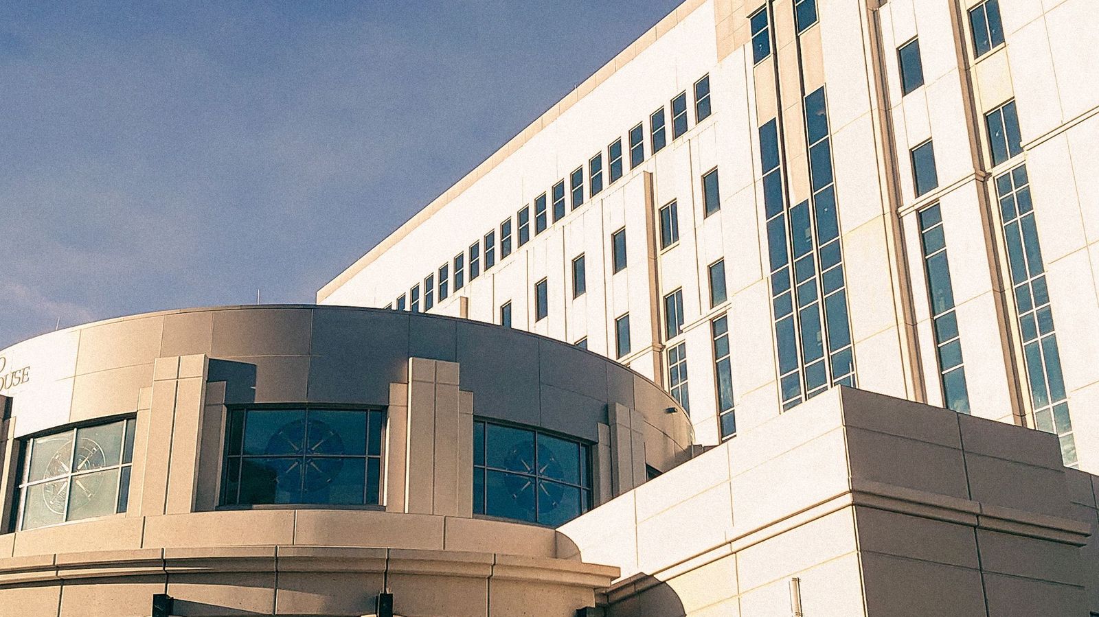 A civic building in downtown New Mexico under a clear blue sky